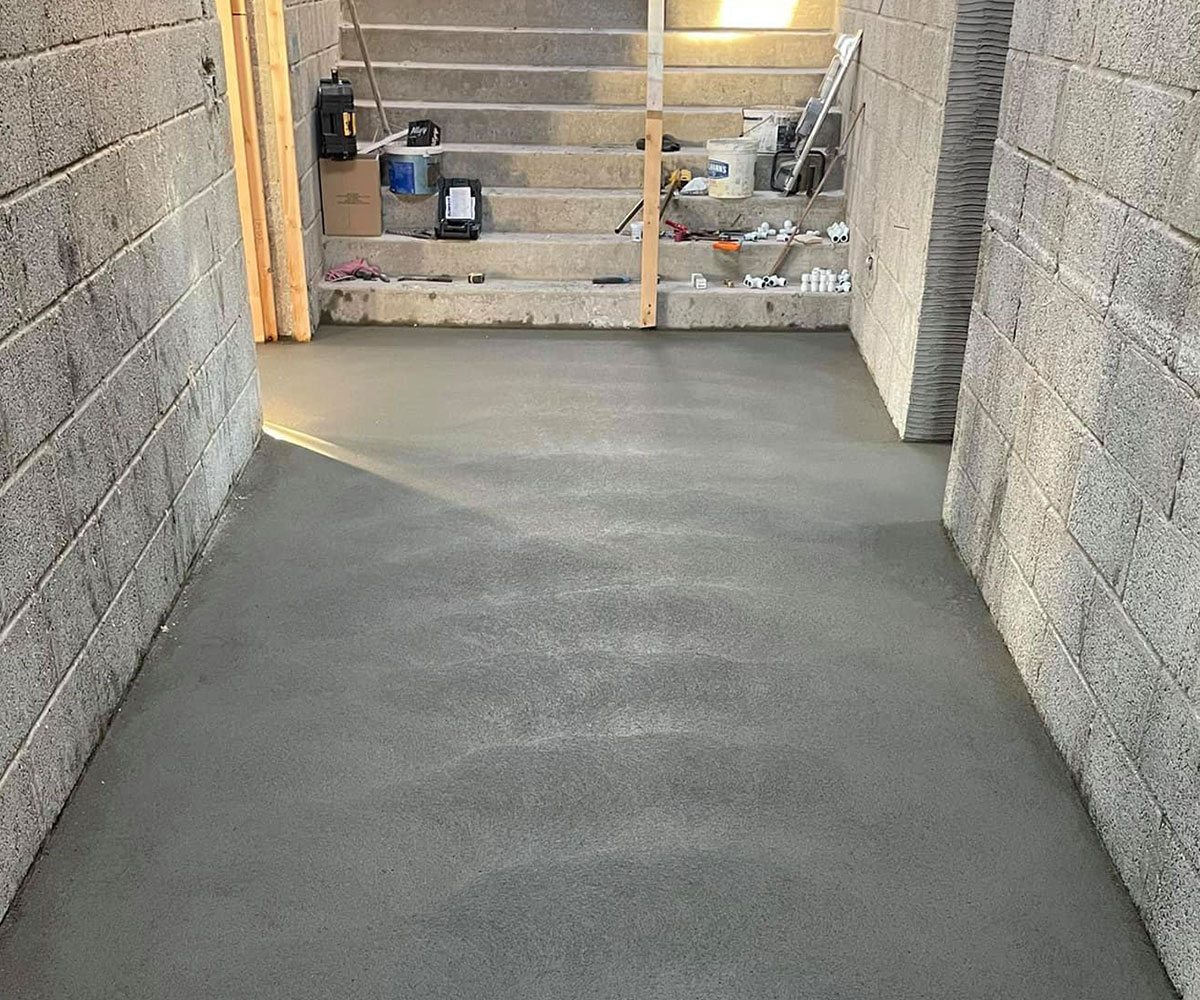 Smooth concrete flooring in a new building hallway