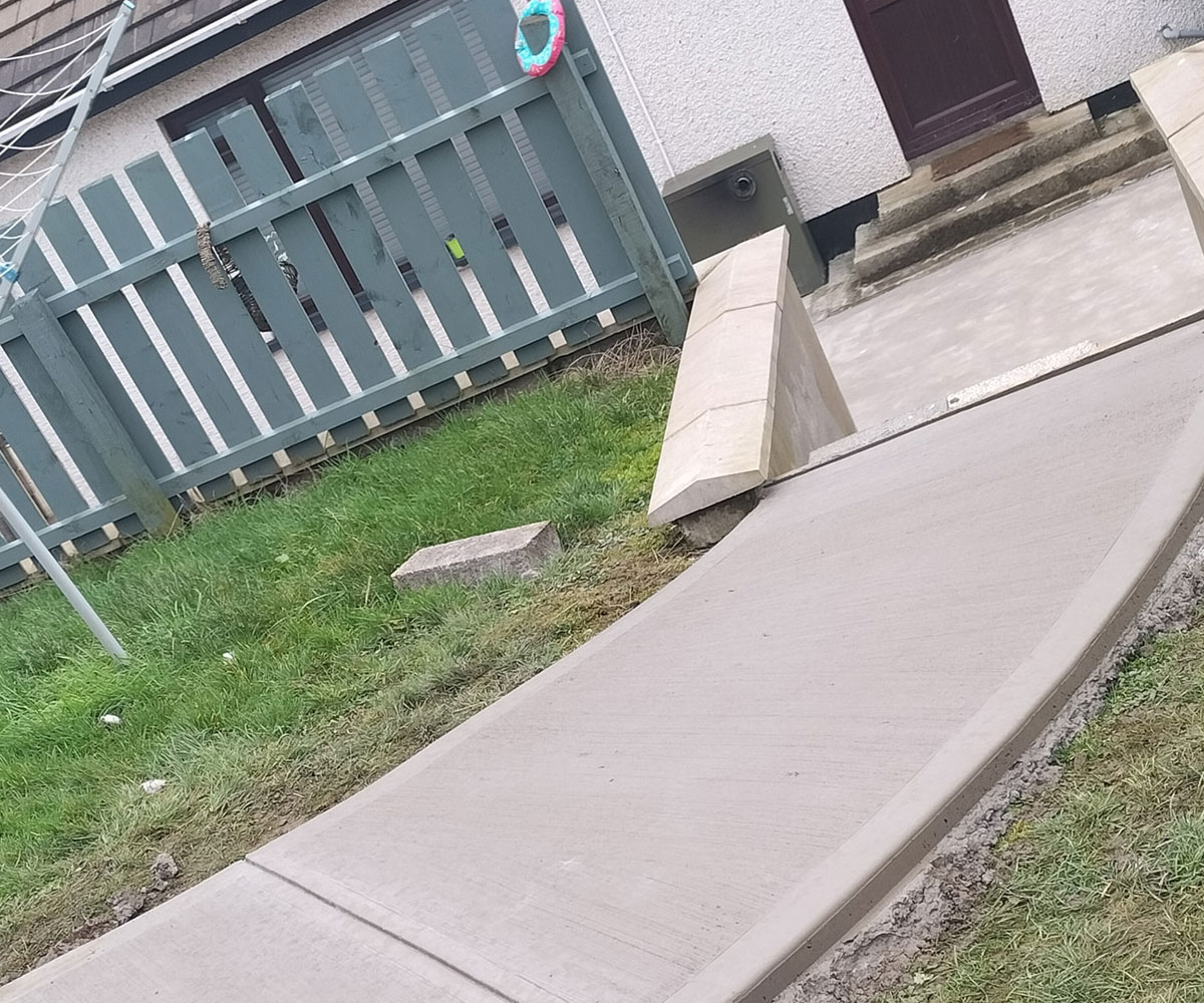 Fleshly constructed concrete path with smooth edging